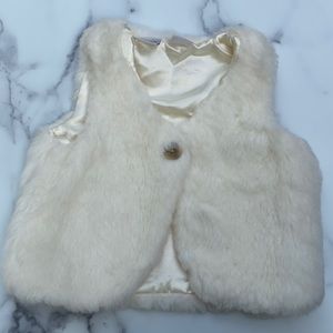 White fur vest